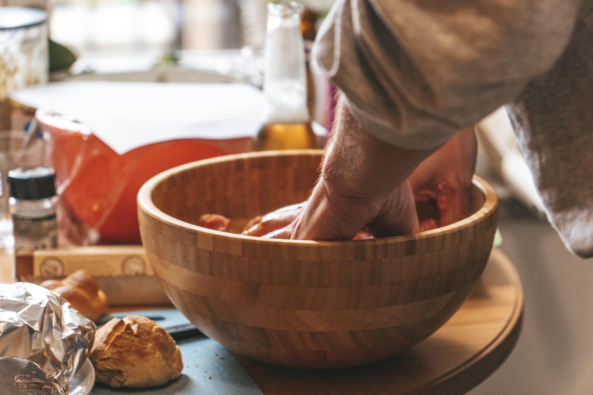 Chef hands arranging a simple bowl