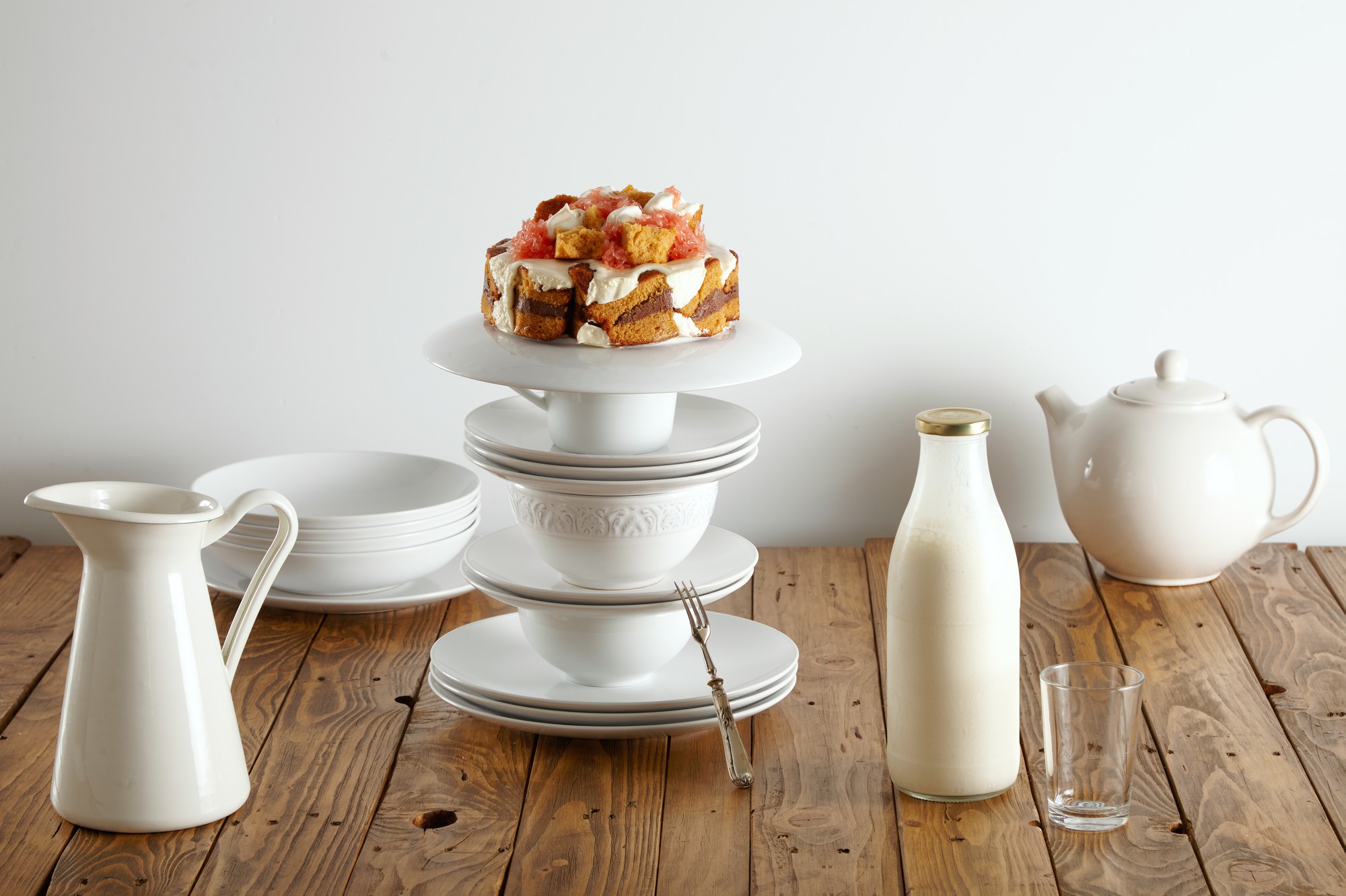 Stacked ceramic plates on sideboard